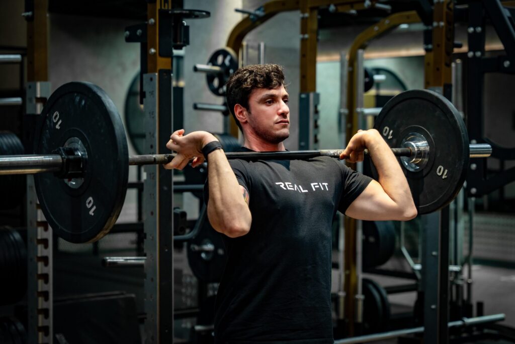 Marcello training with a barbell in the gym